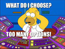 Picture of Homer looking at a console with many buttons. Text saying What do I choose? Too many options!